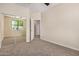 Bedroom featuring carpet, access to a closet, and an ensuite bathroom at 802 W Buist Ave, Phoenix, AZ 85041