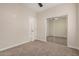 A bedroom features access to a closet, carpet, and a ceiling fan at 802 W Buist Ave, Phoenix, AZ 85041