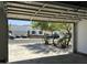 View from the garage out to a neatly landscaped front yard and a quiet residential street at 802 W Buist Ave, Phoenix, AZ 85041