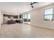 Bright open-concept living space featuring tile floors, a modern kitchen, and access to a large backyard at 802 W Buist Ave, Phoenix, AZ 85041