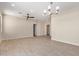 Spacious and bright living room featuring neutral paint, tile floors, modern lighting, and a versatile open layout at 802 W Buist Ave, Phoenix, AZ 85041