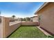 Inviting backyard featuring artificial turf, stucco privacy wall and white metal fence at 871 Leisure World --, Mesa, AZ 85206
