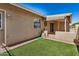 This home offers a charming backyard with artificial turf and a brick-paved covered patio at 871 Leisure World --, Mesa, AZ 85206