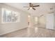 Bedroom with ceiling fan, window, and mirrored closet at 871 Leisure World --, Mesa, AZ 85206