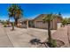 Tan stucco home featuring desert landscaping, a two-car garage, and a covered front porch at 871 Leisure World --, Mesa, AZ 85206