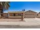 Charming single-story home featuring desert landscaping, a two-car garage, and a cozy front porch at 871 Leisure World --, Mesa, AZ 85206