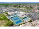 Aerial view of a community center featuring a pool, tennis courts and a well-manicured lawn at 9339 E Sun Lakes N Blvd, Sun Lakes, AZ 85248