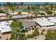 Aerial view of a home with desert landscaping, a gray roof, and golf course views at 9339 E Sun Lakes N Blvd, Sun Lakes, AZ 85248
