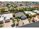 Aerial view of a home with desert landscaping and palm trees in a vibrant neighborhood at 9339 E Sun Lakes N Blvd, Sun Lakes, AZ 85248