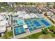 Aerial view of a community center featuring a pool, tennis courts and other amenities at 9339 E Sun Lakes N Blvd, Sun Lakes, AZ 85248