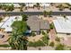 Aerial view of a home with desert landscaping, a gray tile roof, and a well-kept yard at 9339 E Sun Lakes N Blvd, Sun Lakes, AZ 85248
