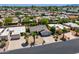 Aerial view of a home with desert landscaping and palm trees in a vibrant community at 9339 E Sun Lakes N Blvd, Sun Lakes, AZ 85248