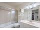 Well-lit bathroom features a shower-tub combo, vanity with ample counter space, and a mirrored cabinet for extra storage at 9339 E Sun Lakes N Blvd, Sun Lakes, AZ 85248