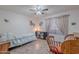 Bright bedroom with a ceiling fan and large window at 9339 E Sun Lakes N Blvd, Sun Lakes, AZ 85248