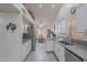 Bright and airy kitchen boasting white cabinets, stainless steel appliances, and a dining area at 9339 E Sun Lakes N Blvd, Sun Lakes, AZ 85248