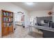Home office with built-in desk, shelves, and connection to adjacent rooms at 9339 E Sun Lakes N Blvd, Sun Lakes, AZ 85248