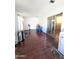 Bonus room with wood floors, sliding glass doors, and a laundry area at 9625 W Mountain View Rd # B, Peoria, AZ 85345