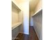 Walk-in closet with wood floor, shelving, and a hanging rack at 9625 W Mountain View Rd # B, Peoria, AZ 85345