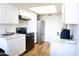 Functional kitchen equipped with stainless steel appliances, ample counter space, and sleek white cabinets for storage at 9625 W Mountain View Rd # B, Peoria, AZ 85345