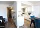 Bright kitchen with skylight, white cabinets, and modern appliances flowing into the dining area at 9625 W Mountain View Rd # B, Peoria, AZ 85345
