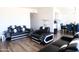 Spacious living room with modern furnishings and sleek hardwood flooring, perfect for entertaining at 9625 W Mountain View Rd # B, Peoria, AZ 85345