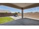 View of a patio with outdoor seating, and an artificial grass area for entertainment at 9723 W Patrick Ln, Peoria, AZ 85383