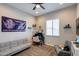 Bedroom featuring neutral walls, carpeted floors, and lots of natural light at 9723 W Patrick Ln, Peoria, AZ 85383