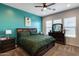 Inviting bedroom with carpet, abundant natural light, and elegant dark wood furniture at 9723 W Patrick Ln, Peoria, AZ 85383
