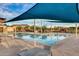 Community pool with ample seating under shaded patio covers at 9723 W Patrick Ln, Peoria, AZ 85383