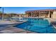 A beautiful community pool, with lounge chairs and covered seating, is a relaxing place to spend the day at 9723 W Patrick Ln, Peoria, AZ 85383