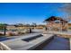 Community outdoor area with fire pit, seating, and pergola, designed for residents to gather and enjoy at 9723 W Patrick Ln, Peoria, AZ 85383