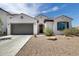 Charming single-story home featuring a low-maintenance front yard, two car garage and tile roof at 9723 W Patrick Ln, Peoria, AZ 85383