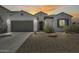 Charming single-story home featuring a low-maintenance front yard, two car garage and tile roof at 9723 W Patrick Ln, Peoria, AZ 85383