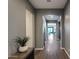 Neutral-colored hallway with sleek wood flooring, recessed lighting, and an open floor plan at 9723 W Patrick Ln, Peoria, AZ 85383