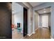 Inviting hallway with a modern design, decorative lighting, and access to other areas at 9723 W Patrick Ln, Peoria, AZ 85383