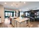 Large kitchen island offering seating and countertops, seamlessly connecting the kitchen to the living area at 9723 W Patrick Ln, Peoria, AZ 85383
