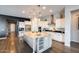 Well-equipped kitchen with a large island, stainless steel appliances, and ample cabinet space at 9723 W Patrick Ln, Peoria, AZ 85383