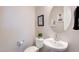 Stylish powder room with modern fixtures, vanity, and decor at 9723 W Patrick Ln, Peoria, AZ 85383
