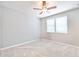 Clean bedroom with a ceiling fan and two windows providing natural light at 10739 W Sierra Pinta Dr, Peoria, AZ 85373