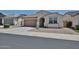 Charming single-story home with a well-maintained front yard and neutral color palette at 10739 W Sierra Pinta Dr, Peoria, AZ 85373