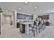 Spacious kitchen features an island with bar seating, stainless appliances, and ample storage space at 10739 W Sierra Pinta Dr, Peoria, AZ 85373