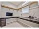A home office featuring a built-in desk area and plenty of natural light at 10739 W Sierra Pinta Dr, Peoria, AZ 85373