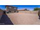 Substantial sized backyard for activities and gardening; with gravel landscaping offering an open area at 11215 W Heatherbrae Dr, Phoenix, AZ 85037