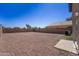Expansive backyard featuring low-maintenance desert landscaping, perfect for outdoor entertaining and relaxation at 11215 W Heatherbrae Dr, Phoenix, AZ 85037