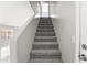 Carpeted staircase leading to the upper level of the home at 11215 W Heatherbrae Dr, Phoenix, AZ 85037