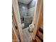 Modern bathroom with a tiled shower, a toilet, and traditional vanity at 12016 N 45Th Ave, Glendale, AZ 85304