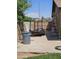 Driveway with a trailer, garbage can, ladder and yard tools at 12016 N 45Th Ave, Glendale, AZ 85304