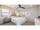 Bright bedroom featuring a cozy bed with decorative pillows, complemented by a modern color palette at 12712 W Corona Ave, Avondale, AZ 85323