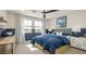 Comfortable bedroom with a large window offering scenic views, complemented by stylish furnishings at 12712 W Corona Ave, Avondale, AZ 85323