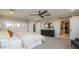 Stylish bedroom showcasing a sliding barn door, ceiling fan, and modern decor at 12712 W Corona Ave, Avondale, AZ 85323